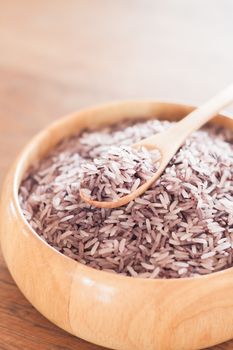 Berry rice in wooden bowl, stock photo