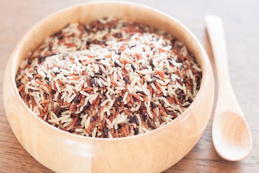 Organic Dry Multi Grain Rice in wooden bowl, stock photo