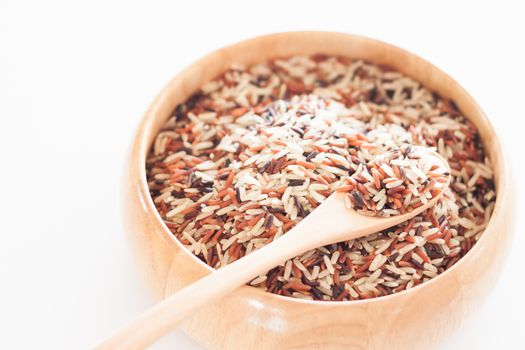 Organic Dry Multi Grain Rice in wooden bowl, stock photo