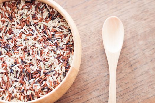 Organic Dry Multi Grain Rice in wooden bowl, stock photo