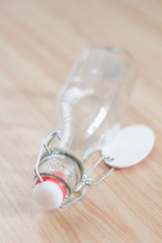 Vintage water bottle on wooden background, stock photo