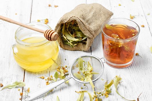 Glass mug with medicinal flower linden tea