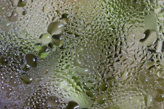 Close up of frying pan lid with water drops
