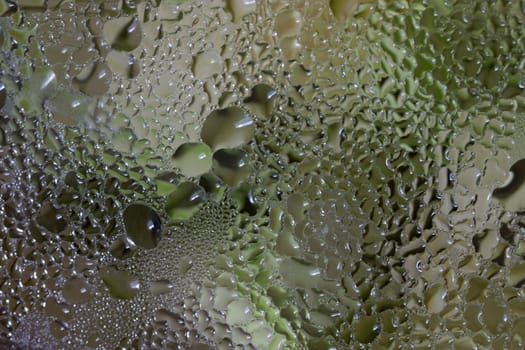 Close up of frying pan lid with water drops