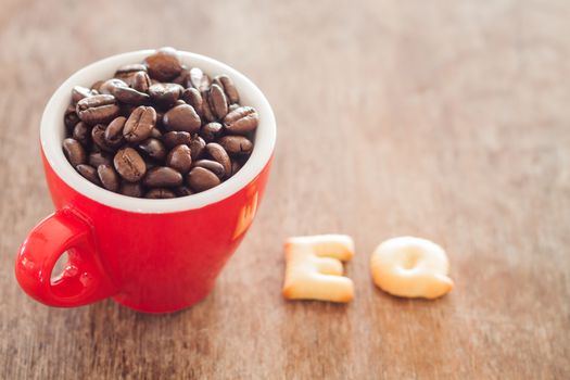 EQ alphabet biscuit with red coffee cup, stock photo