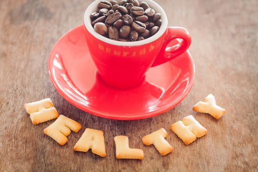 Healthy alphabet biscuit with red coffee cup alphabet biscuit with red coffee cup, stock photo