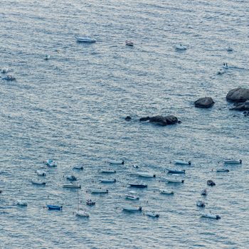 Taormina - Italy: Boats anchored off the coast of Sicily