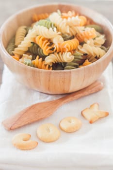 Cook alphabet biscuit with fusili pasta, stock photo