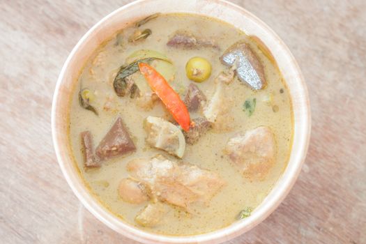 Grren curry in wooden bowl, stock photo
