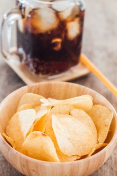 Crispy potato chips with iced cola, stock photo