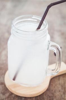 Glass of fresh coconut water, stock photo