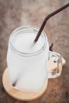 Glass of fresh coconut water, stock photo