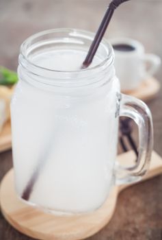 Glass of fresh coconut water, stock photo