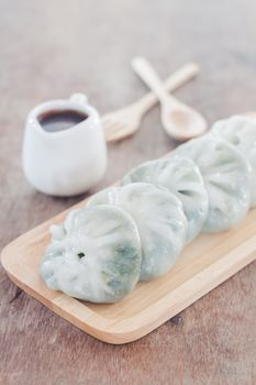 Chinese leek steamed dessert on wooden table, stock photo