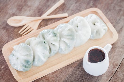 Chinese leek steamed dessert on wooden table, stock photo