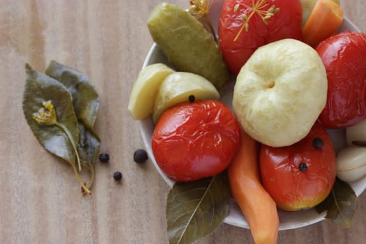 plate of pickled vegetable on wooden table