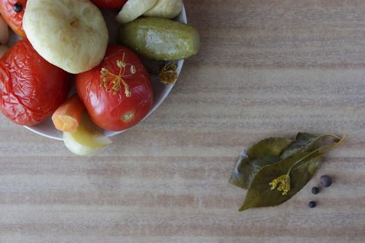 plate of pickled vegetable on wooden table