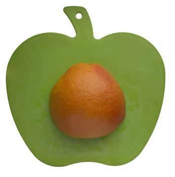 orange on apple shape carving board, isolated