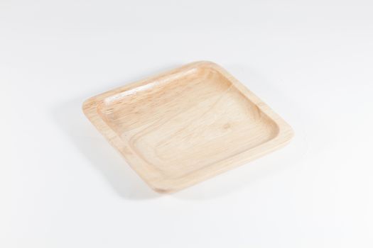 Wooden plate isolated on white background, stock photo