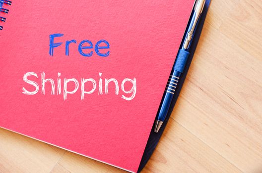 Free shipping text concept write on notebook