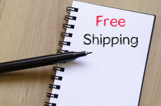Free shipping text concept write on notebook