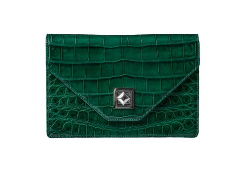 Handbag from alligator leather, hide in green colour on white background no brand