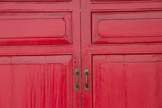 Red wooden closed door on white background