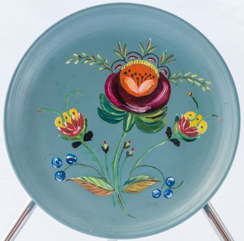 Rosemåling, or rosemaling is the name of a traditional form of decorative folk art that originated in the rural valleys of Norway