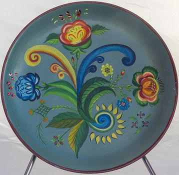 Rosemåling, or rosemaling is the name of a traditional form of decorative folk art that originated in the rural valleys of Norway