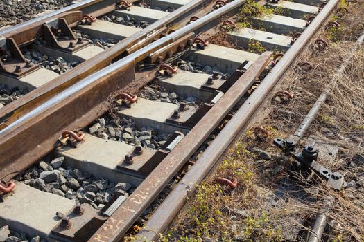 Angle shot of a rusty but still usable railway