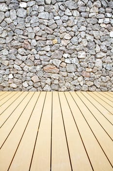 Wooden floor and stone walls background,The rock walls and wooden floor.
