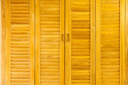 The walls are made of wood, a suitable background.