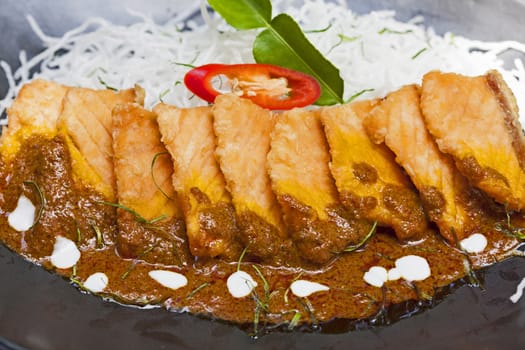 Salmon topped with chili cooking inThailand.