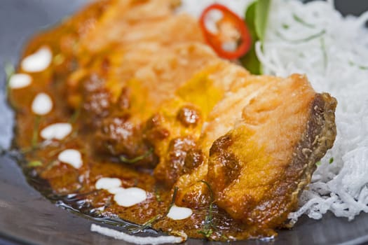 Salmon topped with chili cooking inThailand.