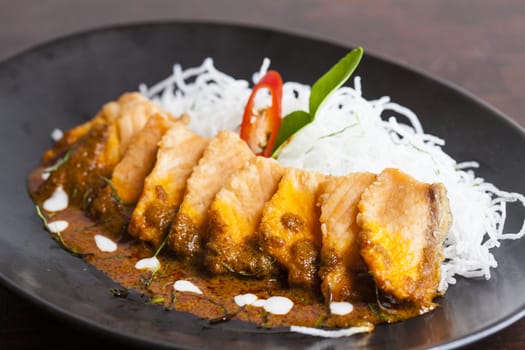 Salmon topped with chili cooking inThailand.