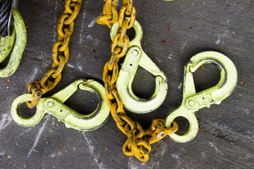 Hoist the heavy lifting,Large chains  Painted yellow.
