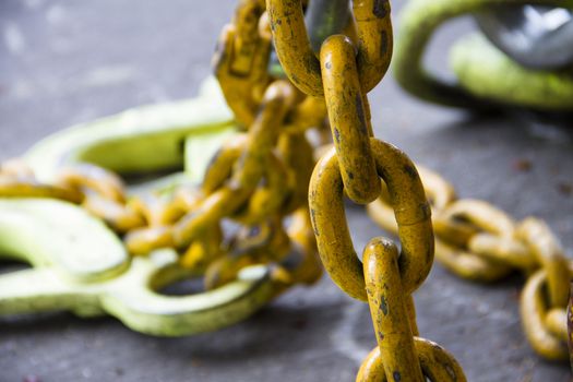 Large chains  Painted yellow,Hoist the heavy lifting.