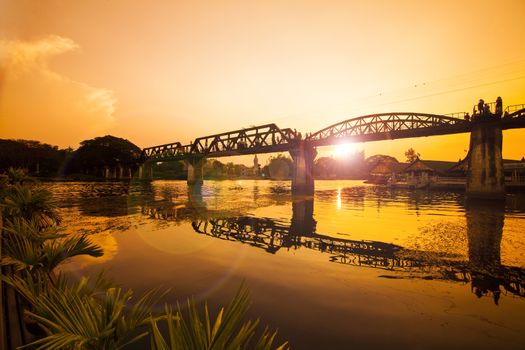 Early morning hours , Train on the bridge over the river Kwai in Kanchanaburi, Thailand. This bridge is famous for its history in second world war.