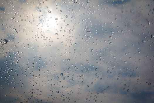 rain drop on the plastic roof with the sun light