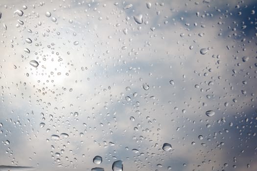 rain drop on the plastic roof with the sun light