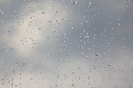 rain drop on the plastic roof with the sun light