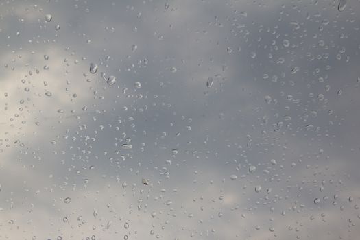 rain drop on the plastic roof with the sun light