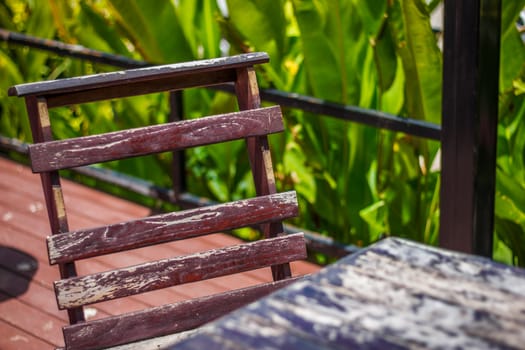 the   wooden chair and wooden table  in the garden