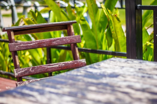 the   wooden chair and wooden table  in the garden