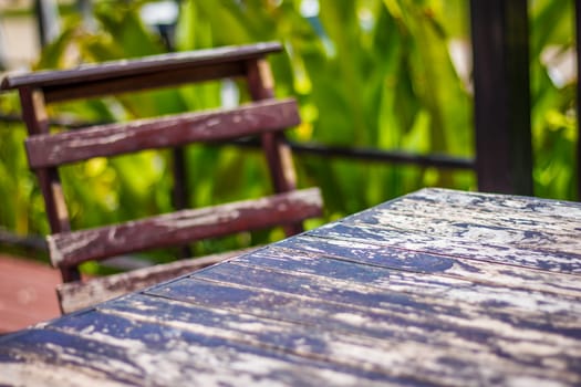 the   wooden chair and wooden table  in the garden