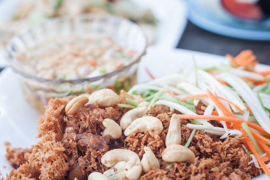 Spicy crispy tuna with green mango salad , stock photo