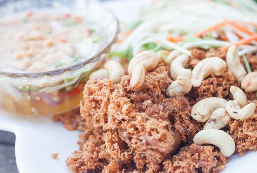 Spicy crispy tuna with green mango salad , stock photo