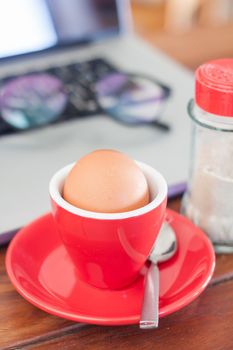 Medium boiled egg breakfast on work station, stock photo