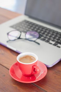 Red coffee cup on work station, stock photo