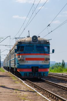 the electric train arrives at the station